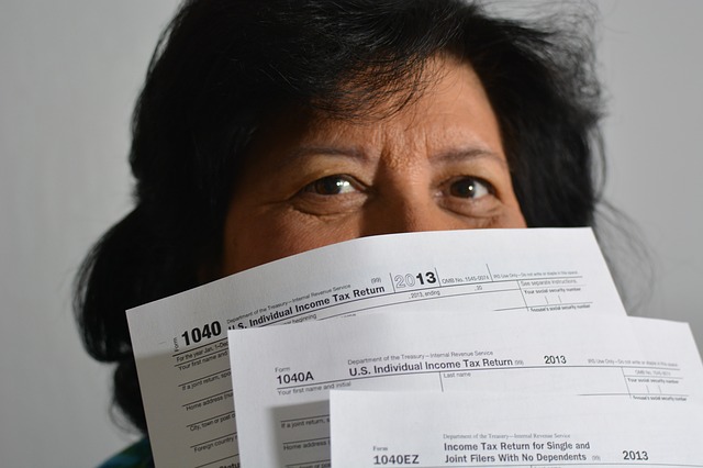 I woman holding tax papers